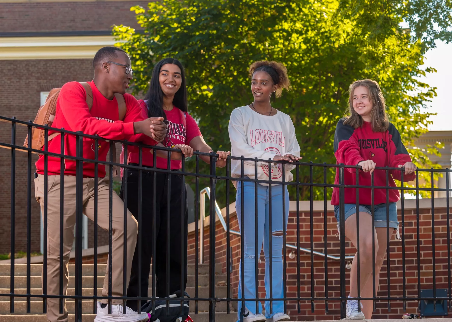 A group of students talking on campus