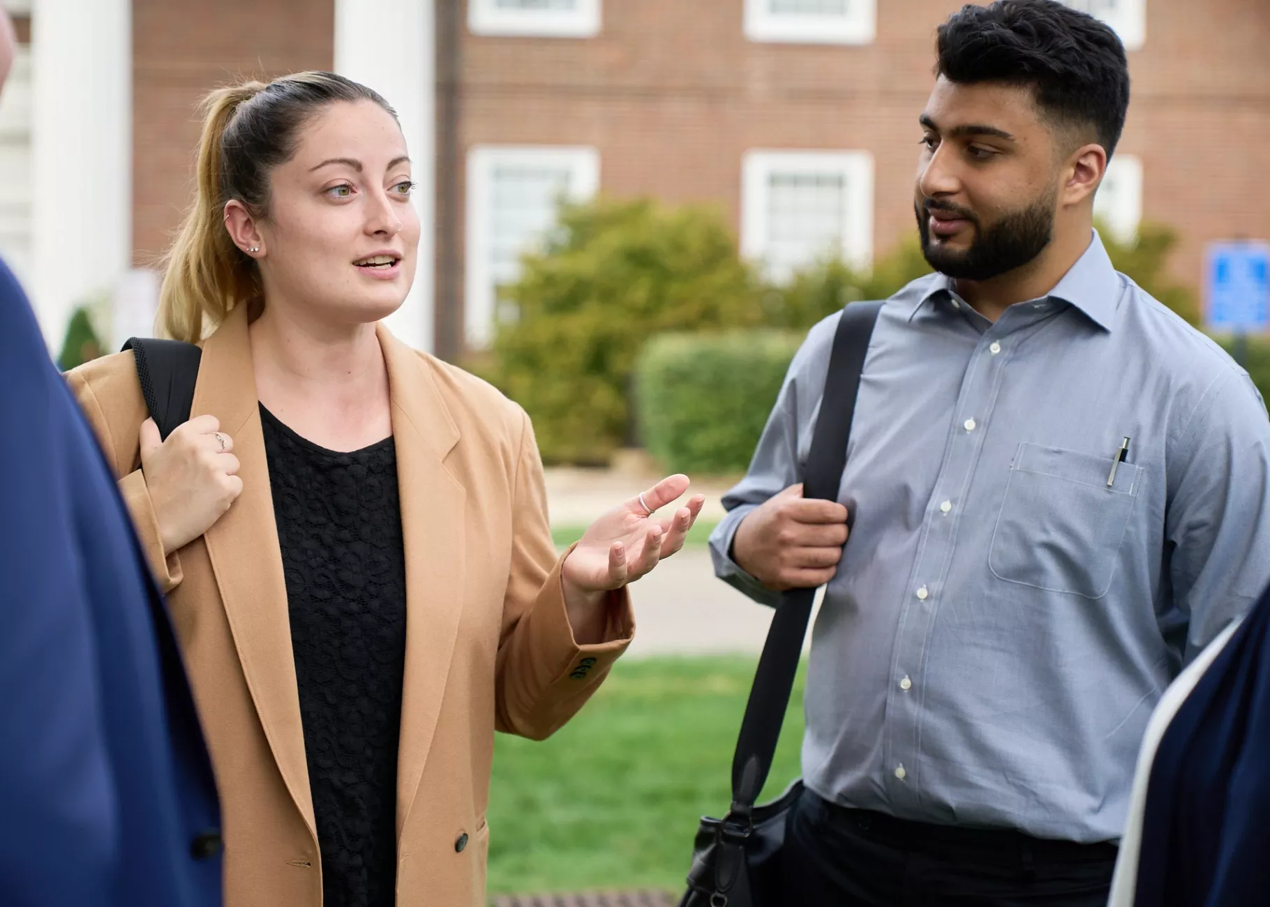 Law students talking in the courtyard of the Brandeis School of Law.
