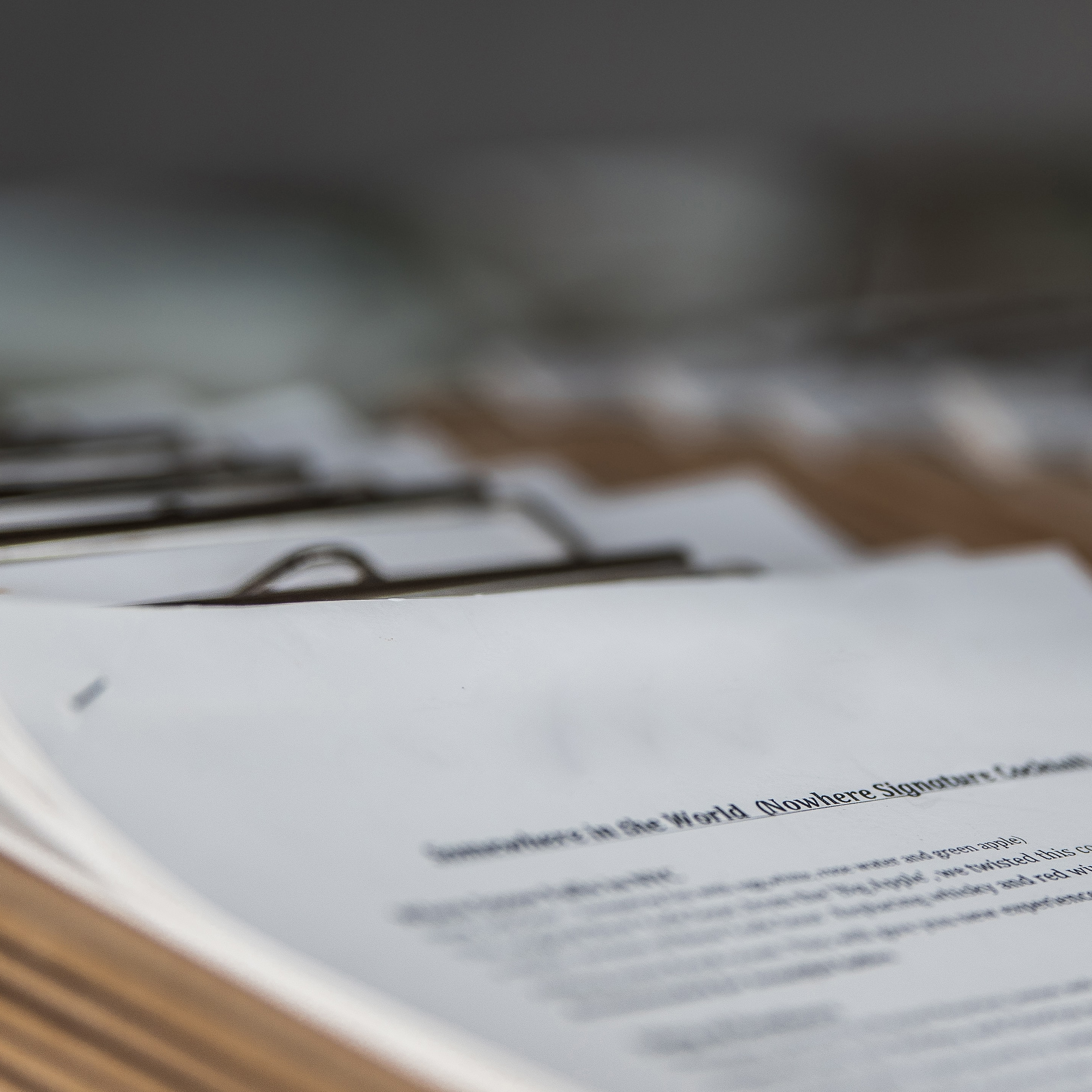 Paper documents on a clipboard