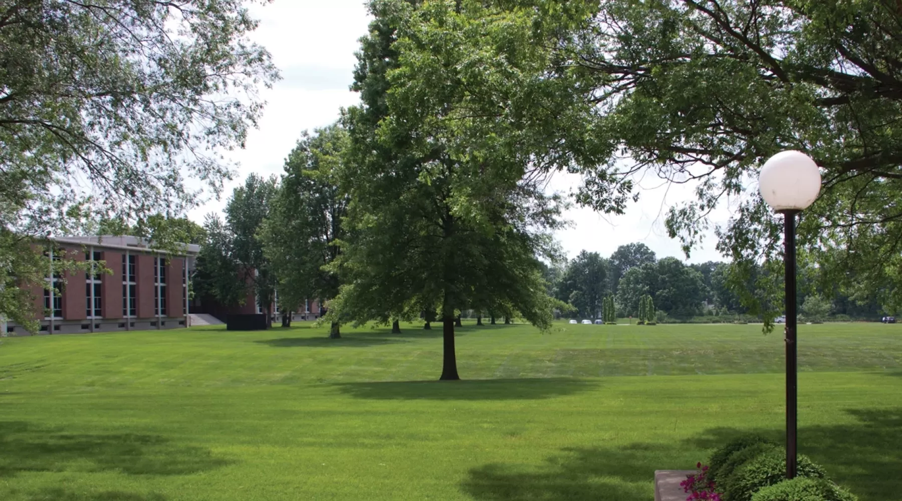 Burhans Hall building and field at Shelby Campus