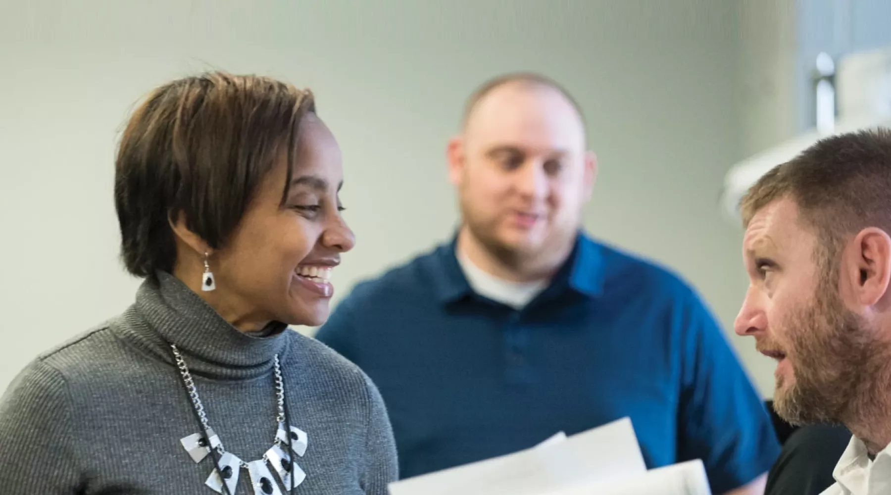 Woman smiling at man during conversation