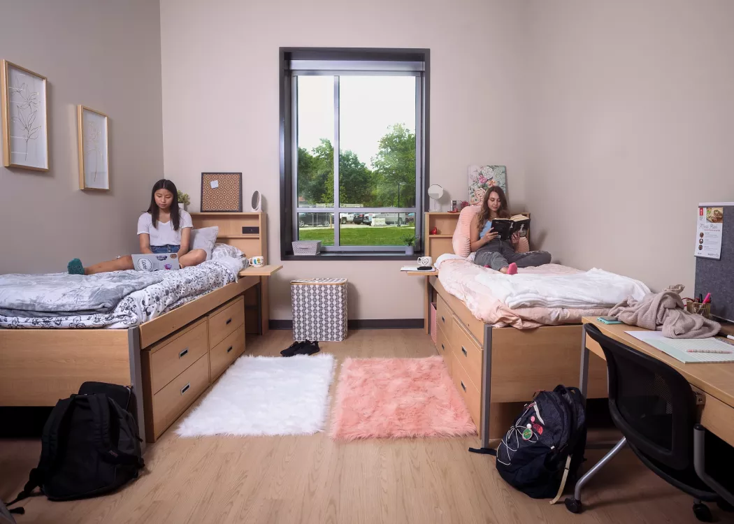 Two students studying the Belknap Village residence hall