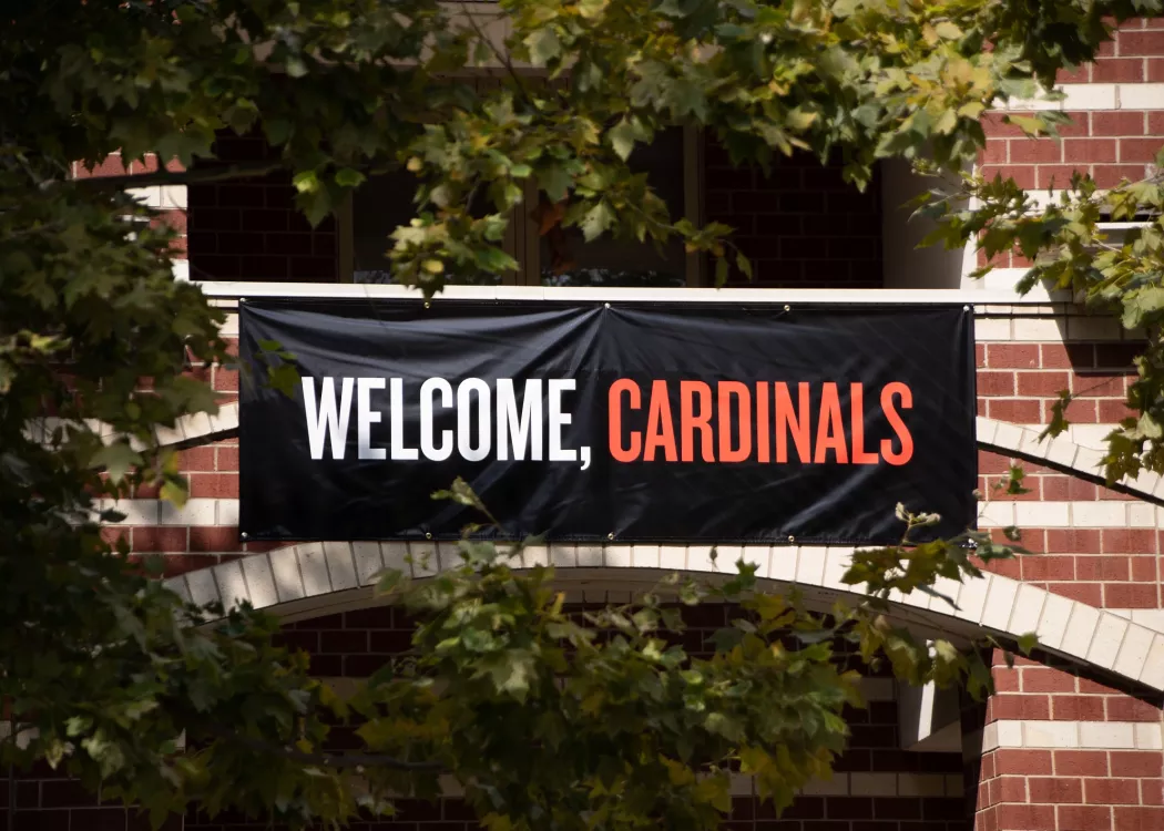 A banner that reads "Welcome, Cardinals" on the front of Community Park on Move-In Day.