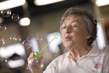 woman blowing bubbles