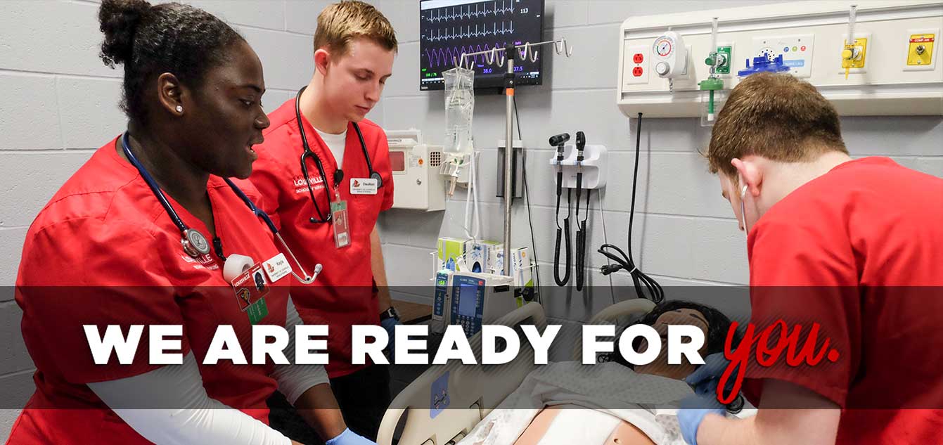 Photo of three nursing students in a simulation lab with a mannequin with overlay that reads 'We are ready for you.'