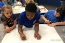 Campers working in teams to design an outpost for living on Mars.