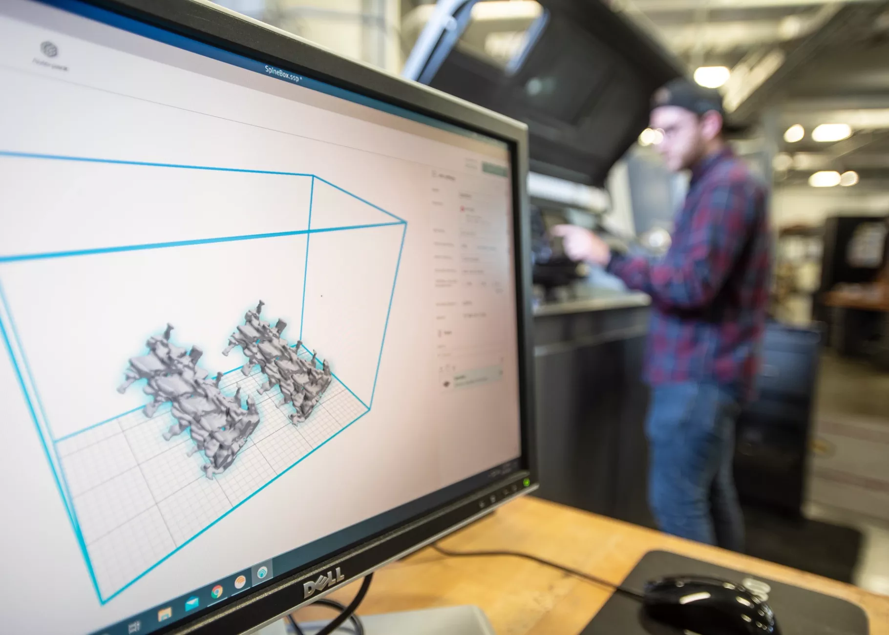 Justin Gillham works on INTERFACE projects in the Additive Manufacturing Institute for Science and Technology (AMIST) lab.