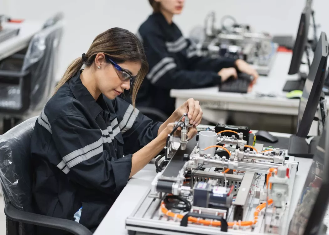 Engineer Caucasian woman learning repair electric board in class