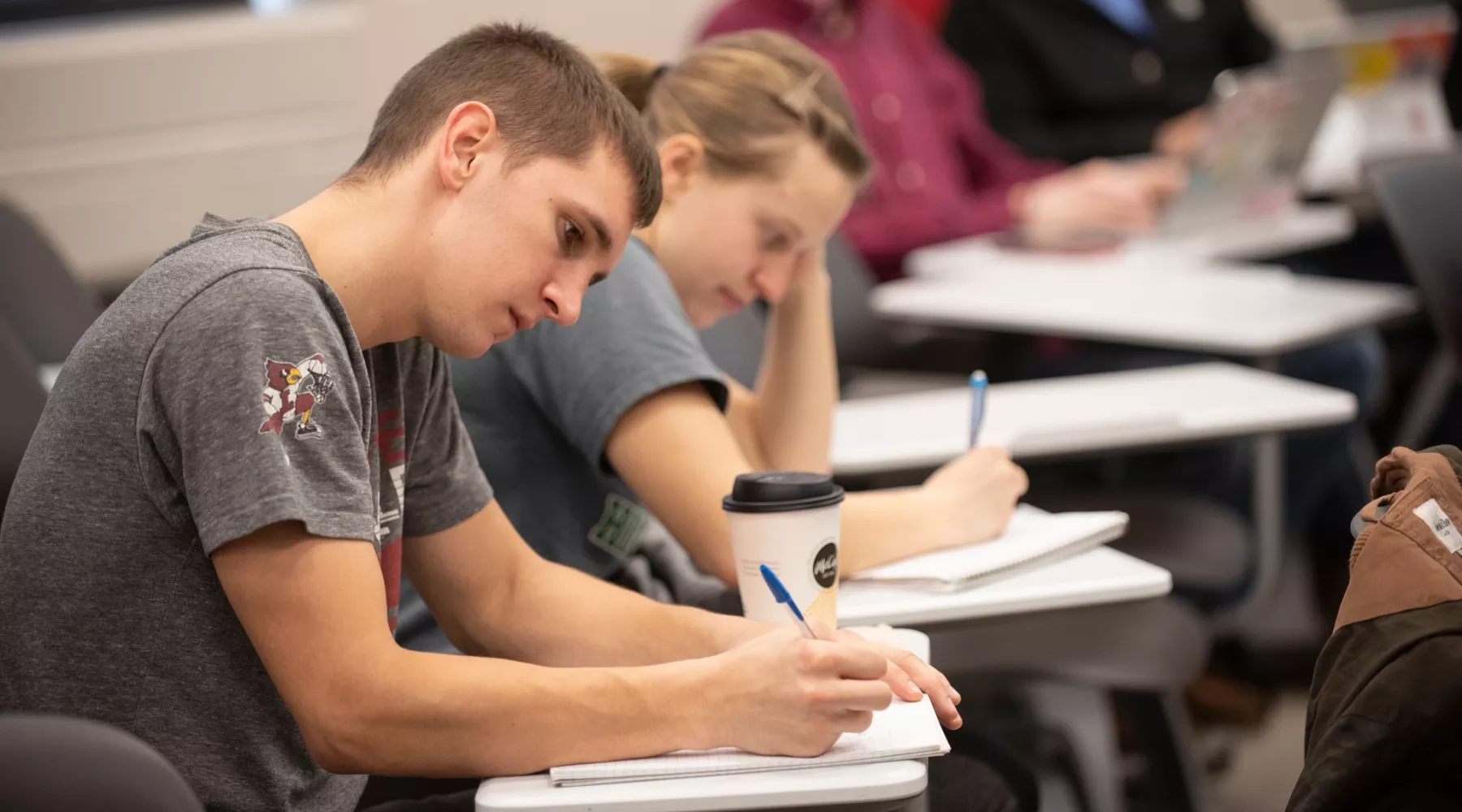 Students take notes during a lecture